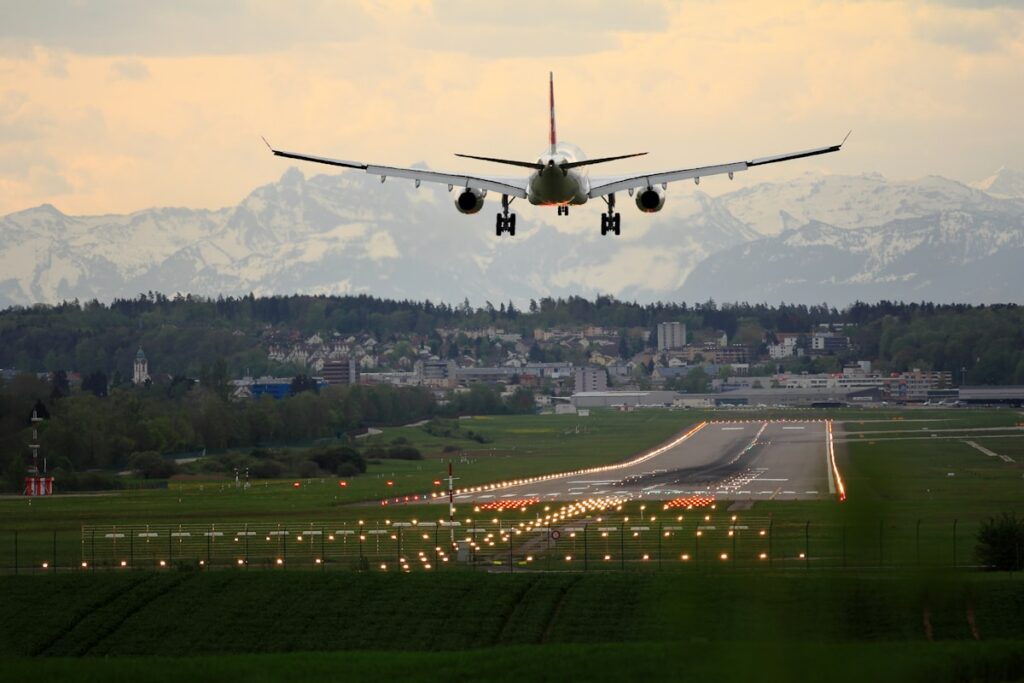 Airplane on runway at golden sunset