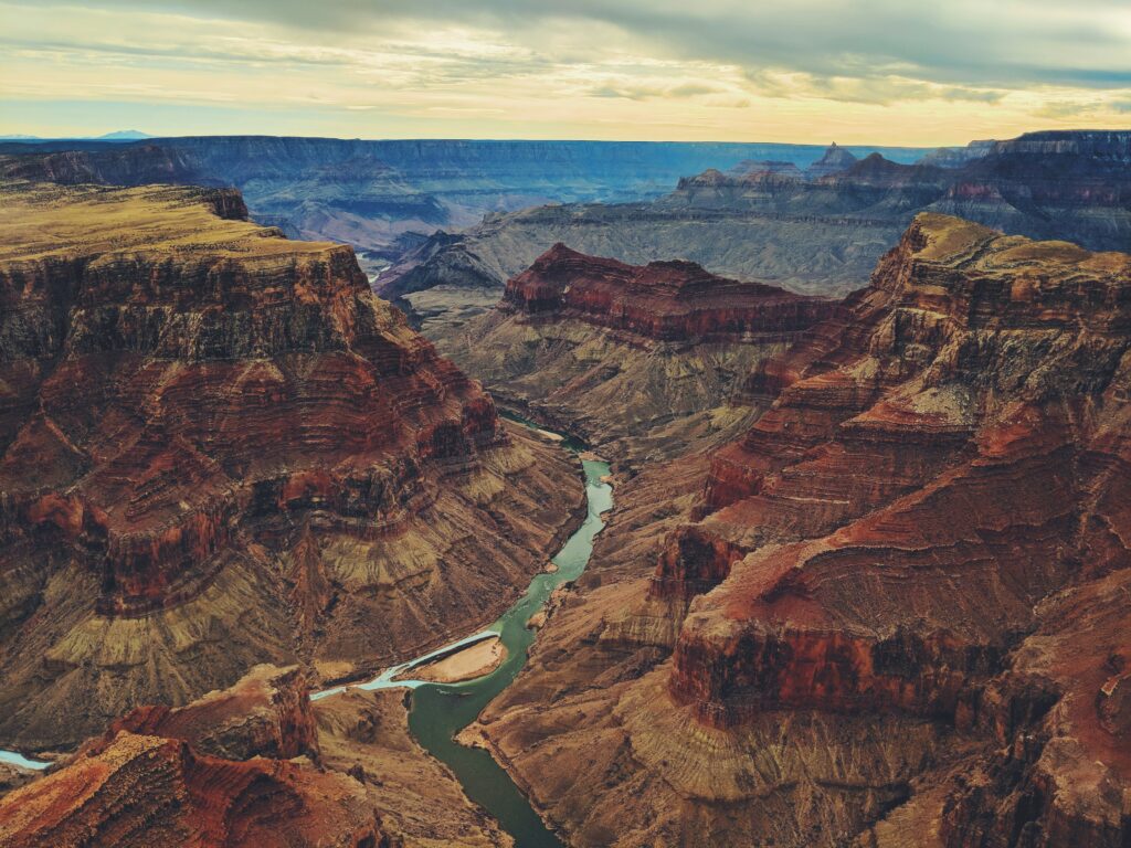 Aerial view of the Grand Canyon with the Colorado River winding through the canyon floor