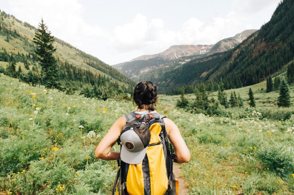 Budget traveler with backpack exploring a US city on foot