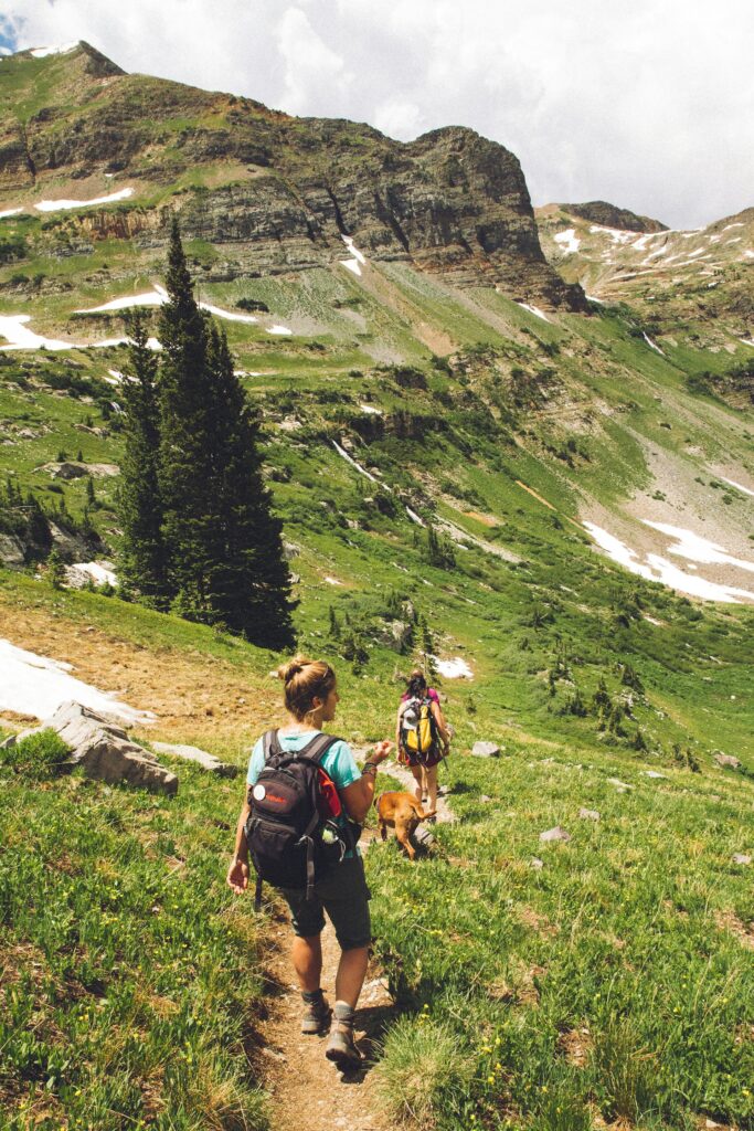Avoid national park crowds: solo hiker walking down a quiet trail with no other people in sight