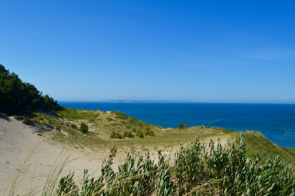 Cheap Great Lakes beach towns: view from Sleeping Bear Dunes over Lake Michigan, Michigan
